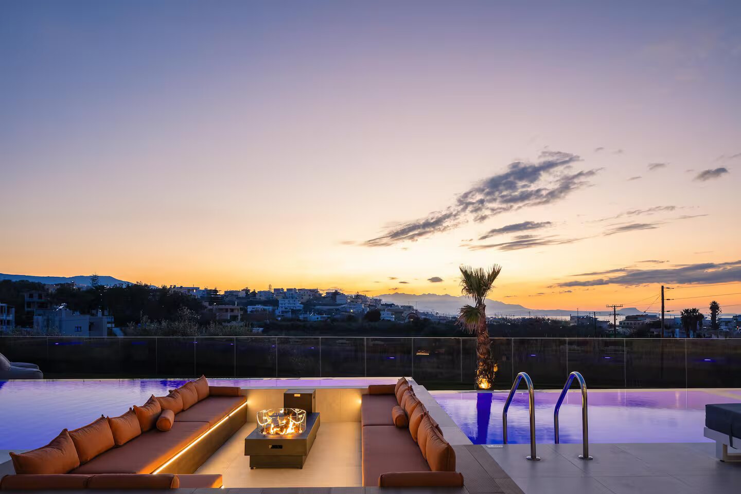 Vellis Residence fire pit and pool at dusk
